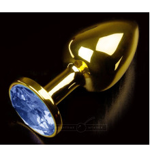 Золотистая анальная втулка с синим стразом - 7 см.