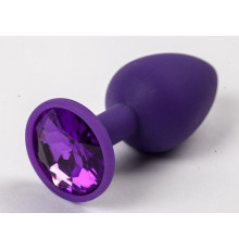 Фиолетовая силиконовая анальная пробка с фиолетовым стразом - 7,1 см.