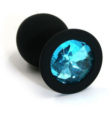 Чёрная силиконовая анальная пробка с голубым кристаллом - 7 см.