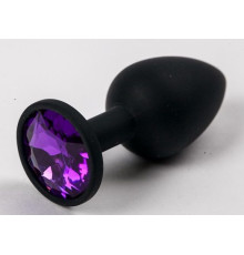 Черная силиконовая анальная пробка с фиолетовым стразом - 7,1 см.