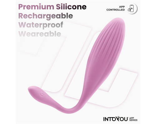 Нежно-розовое интерактивное виброяйцо с функцией вращения Rotating Beads