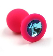Розовая силиконовая анальная пробка с голубым кристаллом - 7 см.