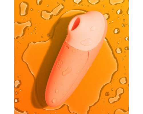 Оранжевый бесконтактный клиторальный стимулятор Romp Switch X